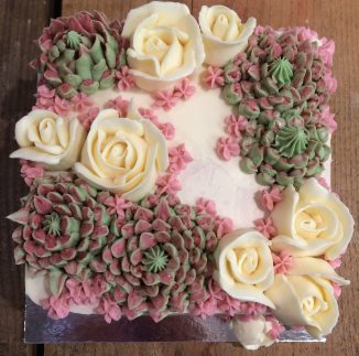 Buttercream succulents roses wedding cake