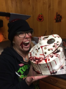 Friday the 13th, a spit cake with a pumpkin cheesecake center and a handmade fondant Jason mask and machete.
